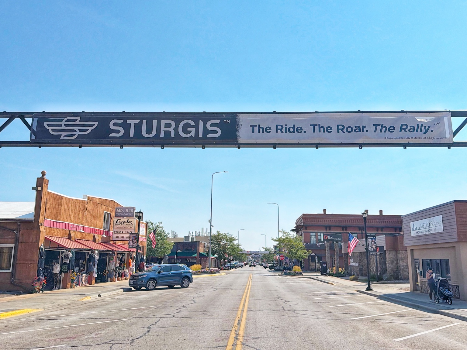 Main Street in downtown Sturgis beneath the Sturgis banner